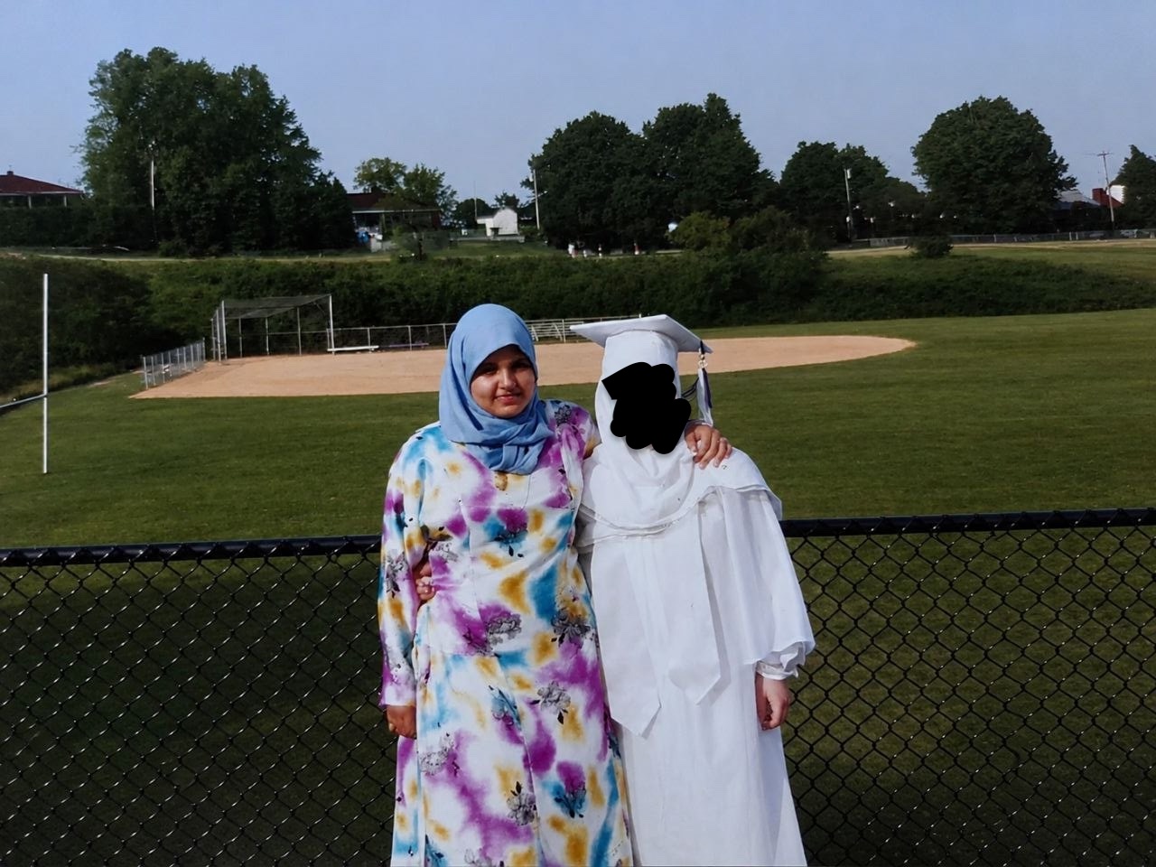 Coach Hebah as a teenager, standing outdoors