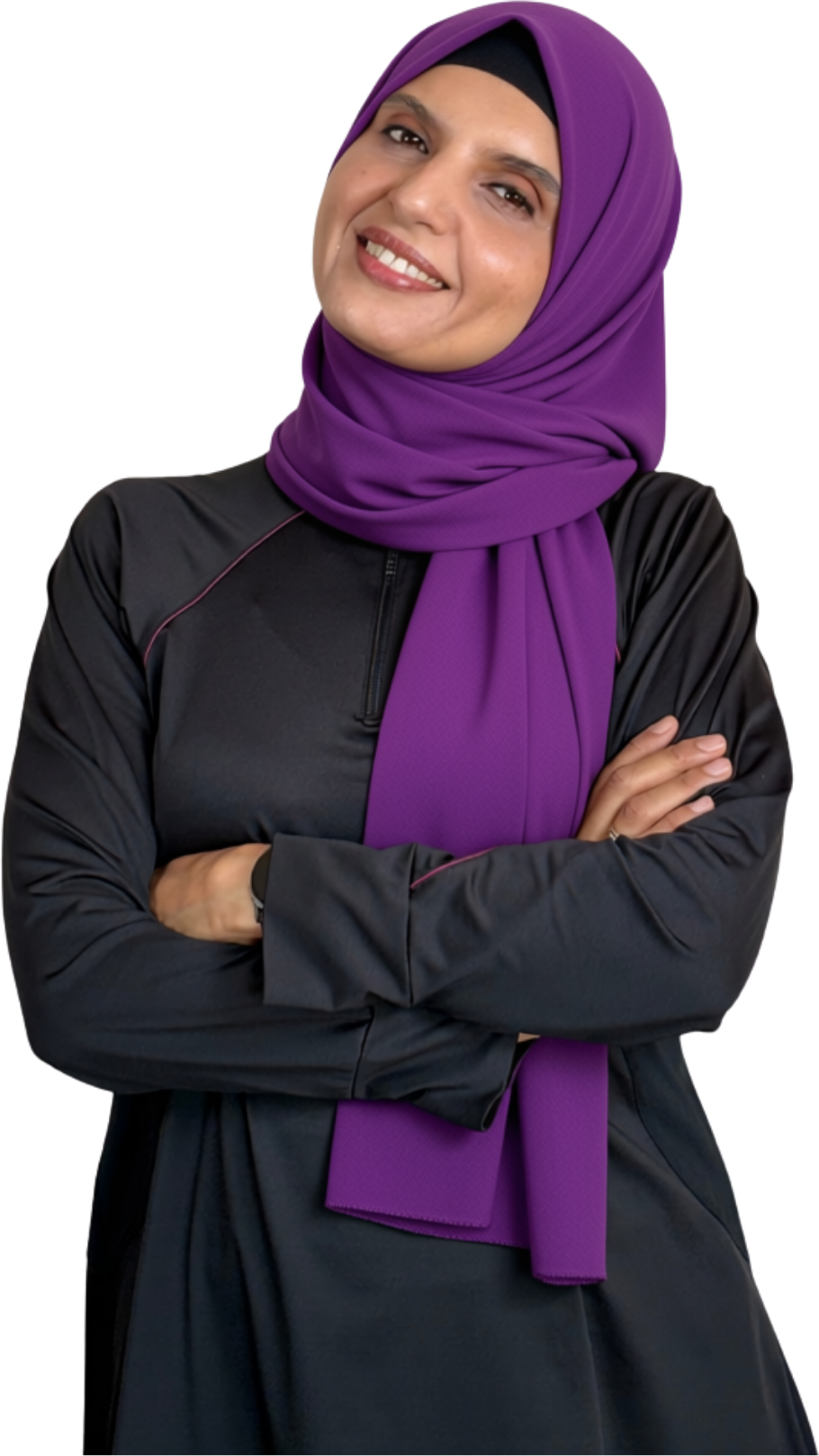 Coach Hebah smiling in a purple hijab and black athletic wear with arms crossed