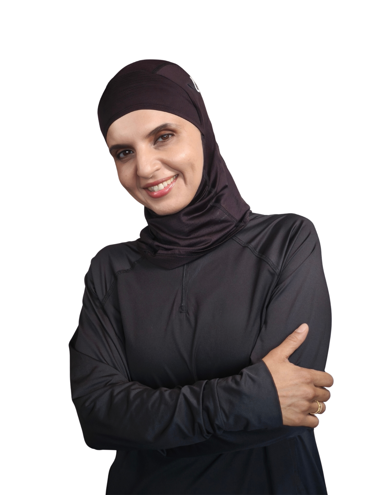 Coach Hebah smiling in a black athletic hijab and long-sleeve top with arms crossed